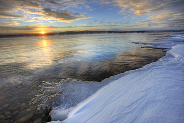 Setting sun over Teslin Lake after a clearing storm, Yukon