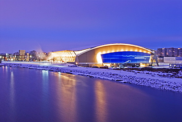 The Richmond Olympic Oval at sunset, the speed skating venue for the 2010 Olympic and Paralympic Winter Games, looking eastward over the North Branch of The Fraser River, Richmond, British Columbia