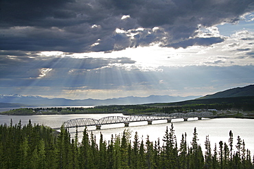 Sun Shining through Clouds over Bridge on Nisutlin Bay, Teslin, Yukon