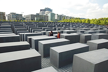 Young women at the Memorial to the Murdered Jews of Europe, Berlin, Germany