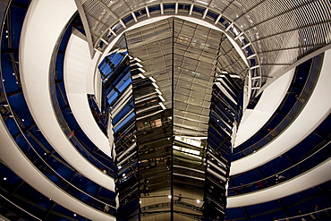 Inside Norman Foster's Dome of the Reichstag Building at night, Berlin, Germany