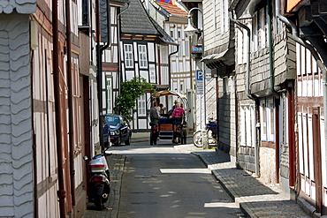 Horse cart tour on a street with half-timbered buildings, Goslar, Germany