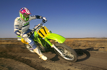 Motocross Racer making turn, Alberta, Canada.