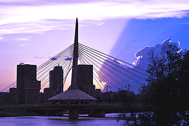 Winnipeg skyline and Esplanade Riel Bridge, from Red River at sunset, Winnipeg, Manitoba