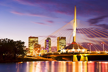 City skyline, Red River and Provencher Bridge at dusk, Winnipeg, Manitoba