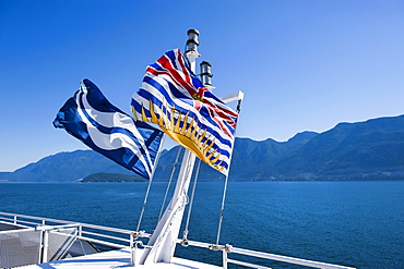 Provincial and BC Ferries flags on ferry to Bowen Island Vancouver, British Columbia