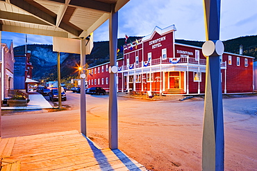 Hotel and houses on Second Ave at dusk, Dawson City, Yukon