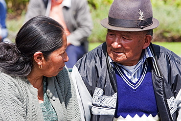 Couple sitting on a bench in Plaza Grande, Quito, Pichincha, Ecuador
