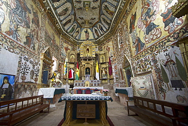 Altarpiece surrounded by Baroque-Mestizo frescos dating to the 17th century in Santiago de Curahuara de Carangas church, the "Sistine Chapel of the Andes", Curahuara de Carangas, Oruro, Bolivia