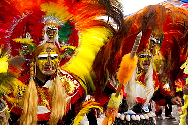 Tobas dancers wearing elaborate masks, feather headdresses and costumes in the procession of the Carnaval de Oruro, Oruro, Bolivia