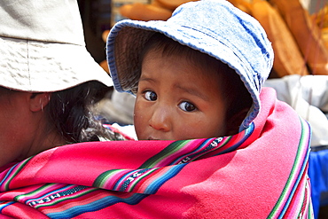 Girl on her mother's back, La Paz, Bolivia