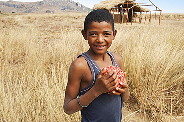 Boy with homemade football Anja, Fianarantsoa Province, Madagascar