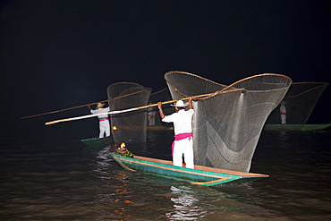 Fisherman with butterfly nets in Lake Putzcuaro at night, Michoacun, Mexico