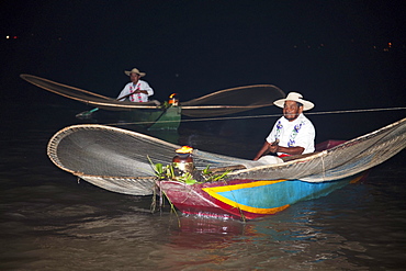 Fishermen with butterfly nets in Lake Putzcuaro at night, Michoacun, Mexico