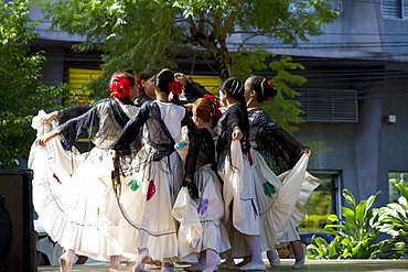 Girls wearing traditional dress performing a Paraguayan polka, Asuncion, Paraguay