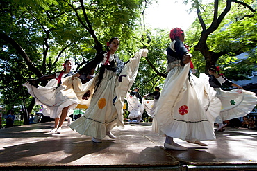 Women wearing traditional dress performing a Paraguayan polka, Asuncion, Paraguay