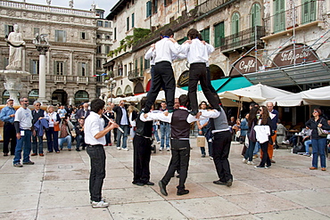 Boys performing a traditional dance on the Piazza delle Erbe, Verona, Italy