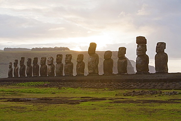 Fifteen moais from different periods, restored by archaeologist Claudio Cristino, at Ahu Tongariki at dawn, Rapa Nui (Easter Island), Chile