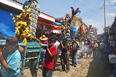 On Easter Sunday the comrades (council men) carry the andas (floats) of the saints in procession through the streets of Chichicastenango, El Quichu, Guatemala