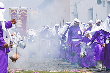 Men and boys wear purple as a sign of mourning at the Procession of the Holy Cross on Good Friday in Antigua Guatemala, Sacatepuquez, Guatemala