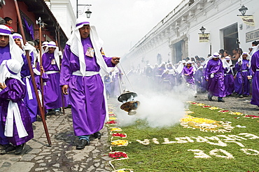 Men and boys wear purple as a sign of mourning at the Procession of the Holy Cross on Good Friday in Antigua Guatemala, Sacatepuquez, Guatemala