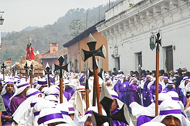 Men carrying the anda (float) of Jesus carrying the Cross during the Procession of the Holy Cross on Good Friday in Antigua Guatemala, Sacatepuquez, Guatemala