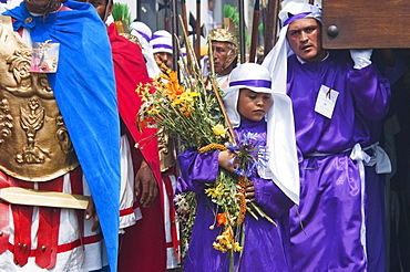 Men and boys wear purple as a sign of mourning at the Procession of the Holy Cross on Good Friday in Antigua Guatemala, Sacatepuquez, Guatemala