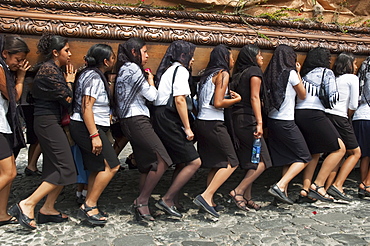 Women dressed in mourning carry the anda (float) of the sorrowful Virgin Mary during a Good Friday Procession in Antigua Guatemala, Sacatepuquez, Guatemala