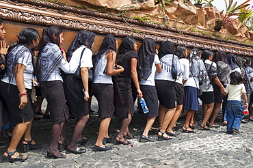 Women dressed in mourning carry the anda (float) of the sorrowful Virgin Mary during a Good Friday Procession in Antigua Guatemala, Sacatepuquez, Guatemala