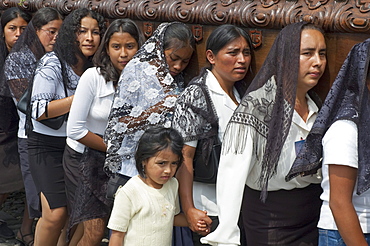 Women dressed in mourning carry the anda (float) of the sorrowful Virgin Mary during a Good Friday Procession in Antigua Guatemala, Sacatepuquez, Guatemala