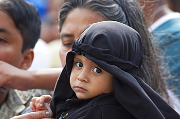 Little boy dressed in mourning at the Holy Burial Procession on Good Friday in Antigua Guatemala, Sacatepuquez, Guatemala