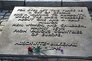 Memorial stating 'For ever let this place be a cry of despair and a warning to Humanity, where the Nazis murdered about one and a half million men, women and children, mainly Jews from various countries of Europe' at the Auschwitz-Birkenau Concentration Camp, Oswiecim, Malopolska, Poland