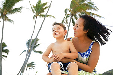 Hawaii, Oahu, A happy mother interacting with her son.