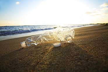 Hawaii, Oahu, Bottle of water on the beach.