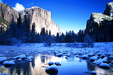 California, Yosemite National Park, Yosemite Valley, Snowy landscape of El Capitan and Merced River.