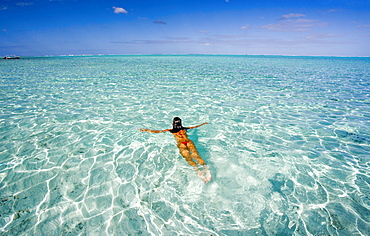 French Polynesia, Tahiti, Bora Bora, Woman enjoy a day in the ocean.