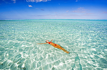 French Polynesia, Tahiti, Bora Bora, Woman enjoy a day in the ocean.