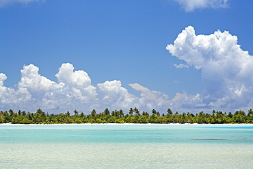 French Polynesia, Tahiti, Maupiti, lagoon, island with bright blue sky.