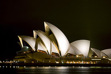 Australia, Sydney, A night scene looking across Sydney Harbor to the iconic Opera House.