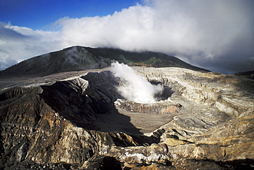 Costa Rica, Poas Volcano National Park, Steaming crater on mountain top, View from above.