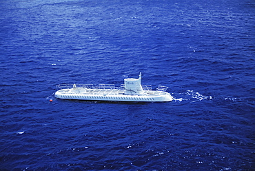 Hawaii, Oahu, Waikiki, Atlantis Sub topside coming out of water, view from above.