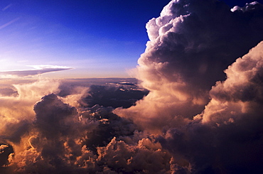 Beautiful pink light from sunset glowing on storm clouds.