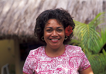 Fiji, Portrait of mature local woman in colorful dress.