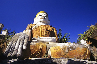 Burma (Myanmar), Inle Lake, Nanthe Village, Kyaukpygyi Paya, close-up of Buddha statue, view from below.