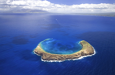 Hawaii, Maui, Molokini with West Maui in the distance.