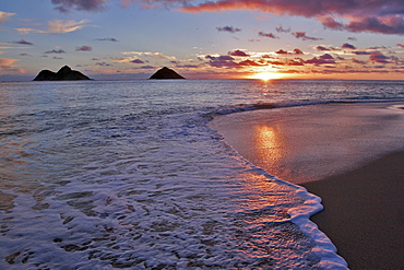 Hawaii, Oahu, Lanikai, sunrise with the Mokulua islands in the distance.