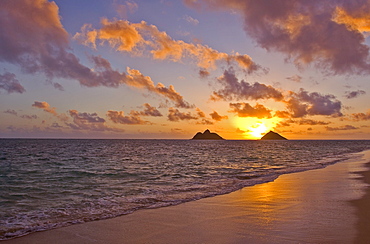 Hawaii, Oahu, Lanikai, sunrise with the Mokulua islands in the distance.