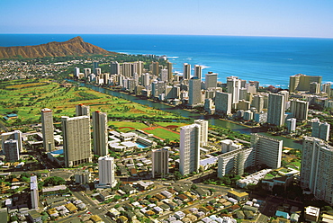 Hawaii, Oahu, Aerial view of Diamond Head, Waikiki and golf course near ocean