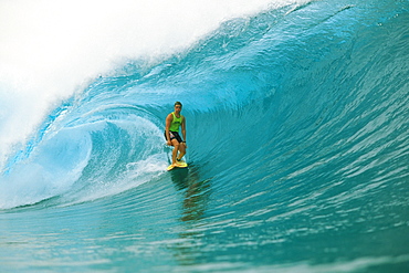 Sean Briley surfs standing on board, big wave curling