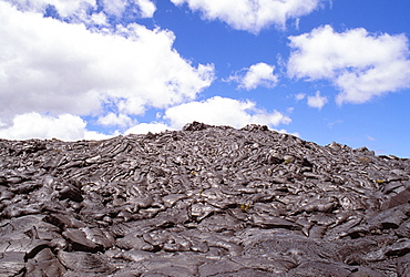 Hawaii, Big Island, Saddle Road, Pahoehoe lava field, blue skies, clouds